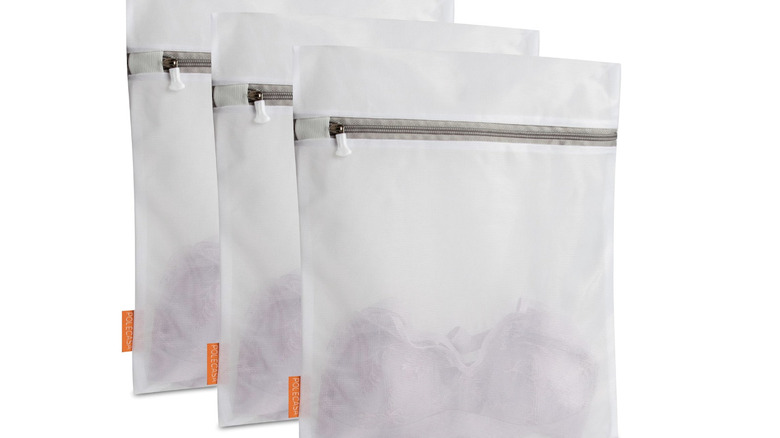 Close up of Polecasa Three-Piece Extra Durable Mesh Laundry Bags with zippers on white background
