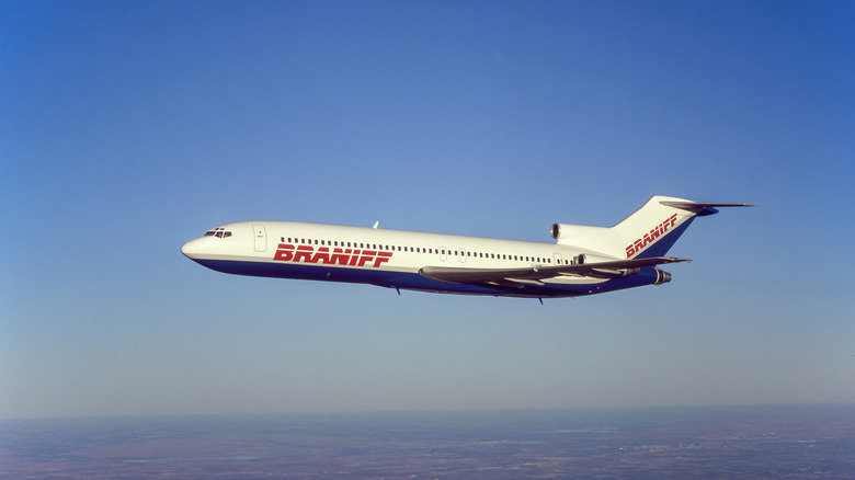 White Braniff plane flying over Central California