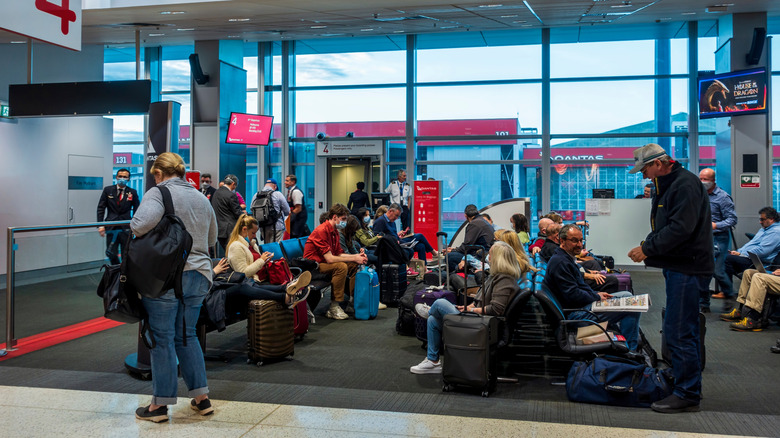 Syndey International Airport, Qantas Terminal with people waiting in it