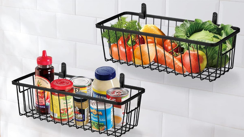 SheeChung Metal Wire Baskets hung on the wall holding food items.