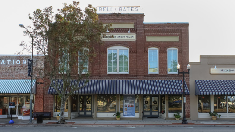 Quincy, Florida United States - December 23 2025: a historic building with a rooftop sign in the morning sunlight