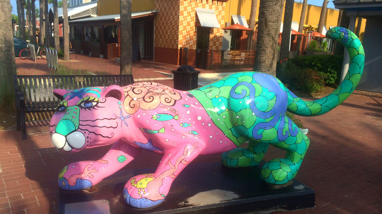 A brightly painted jaguar on a sidewalk in downtown Neptune Beach, Florida, an eclectic beachfront suburb known for its vibrant culture