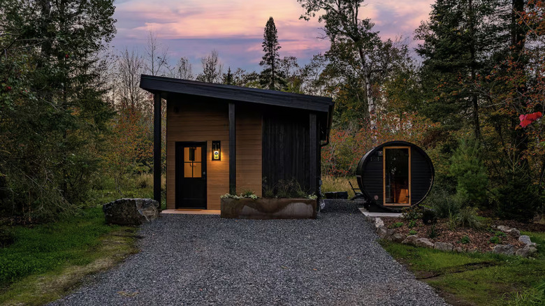 Modern wooden cabin with sauna in the forest