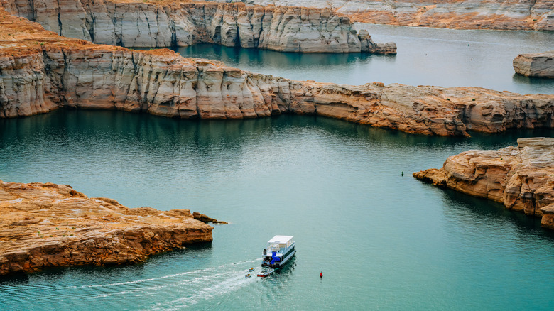 Boat cruising through Lake Powell