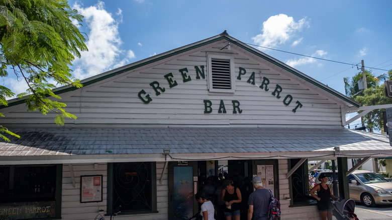 People inside and outside of Green Parrot Bar