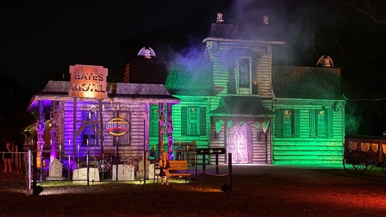 View of the Bates Motel with green spotlight on it at night