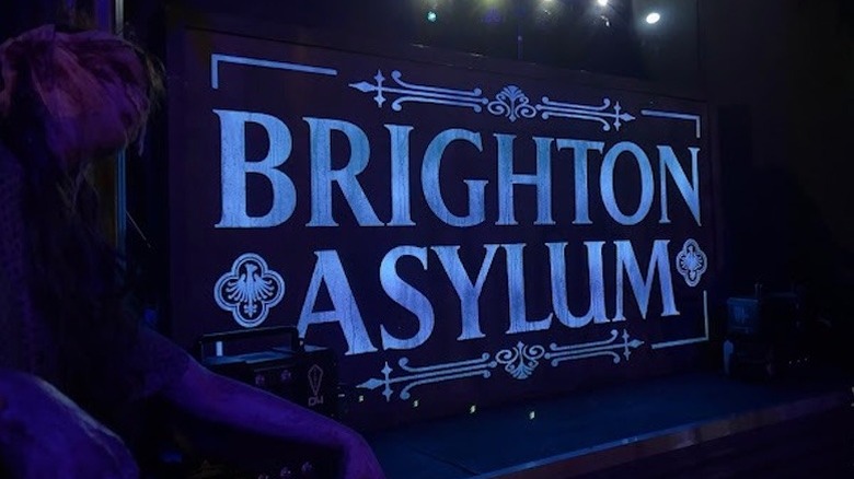 Brighton Asylum sign lit up at night in New Jersey