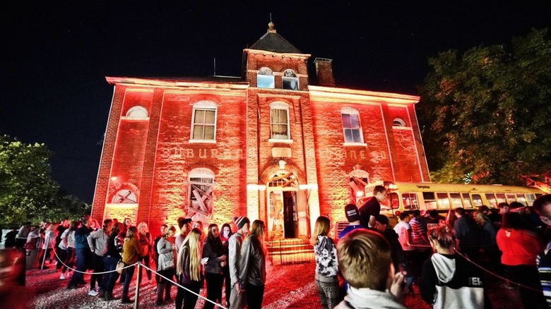Line of visitors waiting to enter Dent Schoolhouse at night