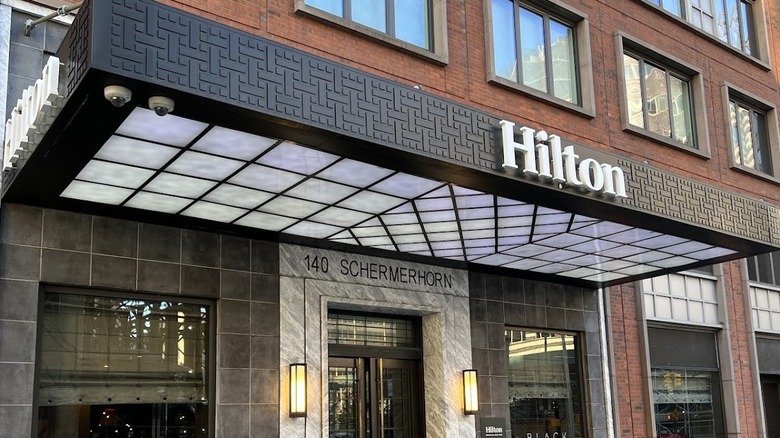 Exterior view of the red brick Hilton Brooklyn building in historic downtown Brooklyn, New York City