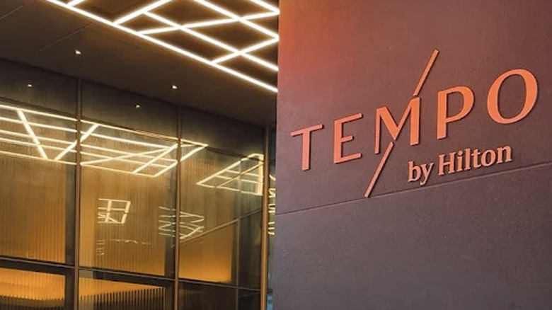 Exterior sign of Tempo by Hilton hotel in Times Square in the evening