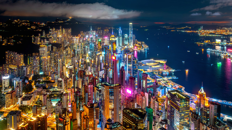 Hong Kong skyline from nearby mountain peak at night