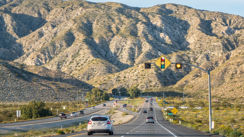 Cars driving on a long road