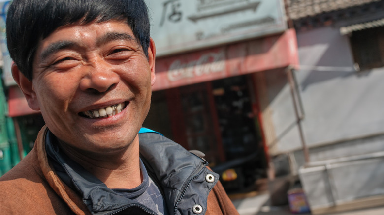 A friendly rickshaw driver in Beijing, China