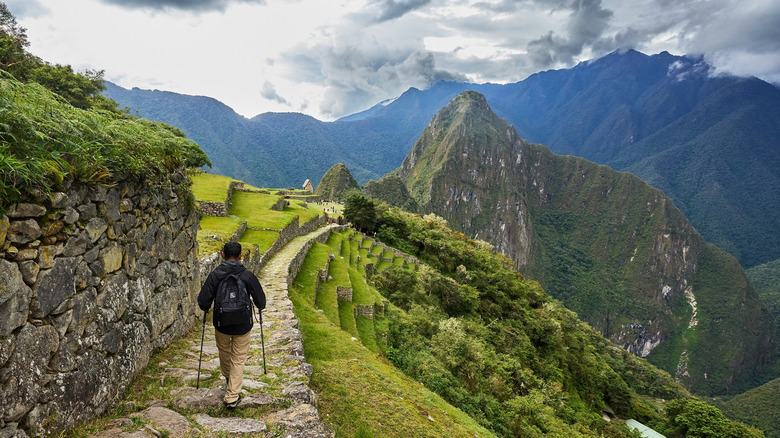 A hiker approaching the Sun Gate before Machu Picchu.