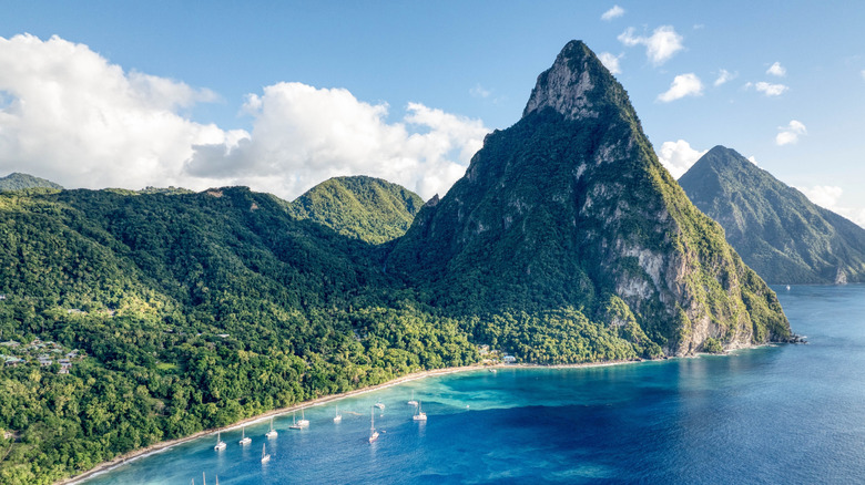 Aerial view of yachts anchored in front of the Gros Piton mountain peak in Soufriere, Saint Lucia