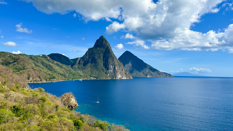 View of the iconic St. Lucia Pitons on a sunny day with the Caribbean Sea in the forground