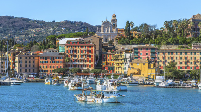 Scenic view of Santa Margherita Ligure, colorful fishing boats, pastel houses with grand church in the backdrop