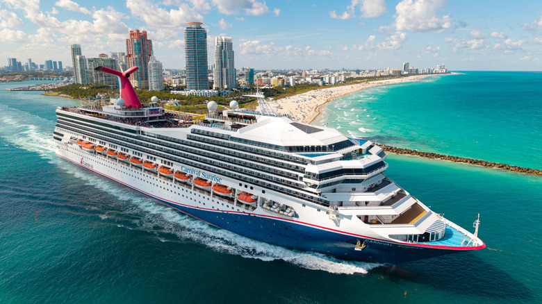 Overhead view of Carnival Sunrise cruise ship departing from the Port of Miami on a sunny day