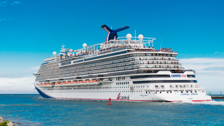View of the Carnival Horizon leaving the Port of Miami with blue skies behind it