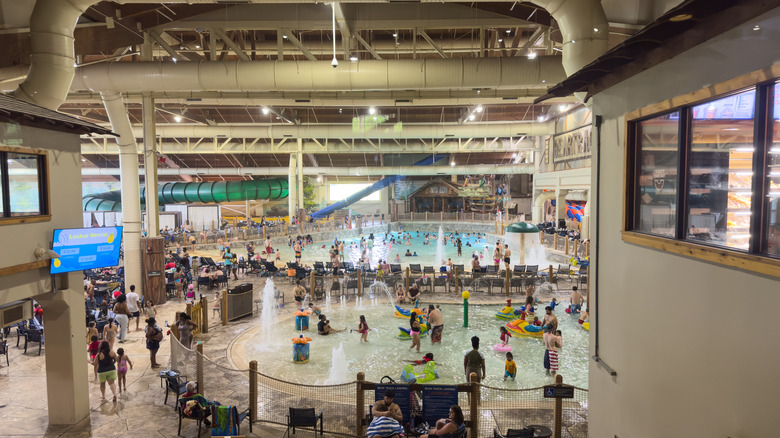 View of busy indoor water park at a Great Wolf Lodge location