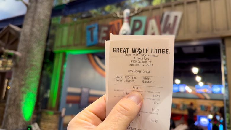 Hand holding a Great Wolf Lodge receipt from the Manteca, California location