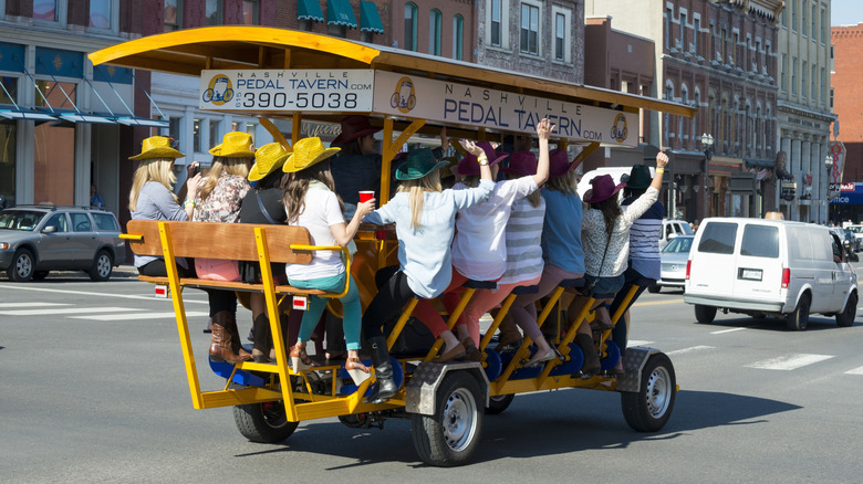 A bachelorette party rides down Broadway in a pedal tavern in Nashville, Tennessee