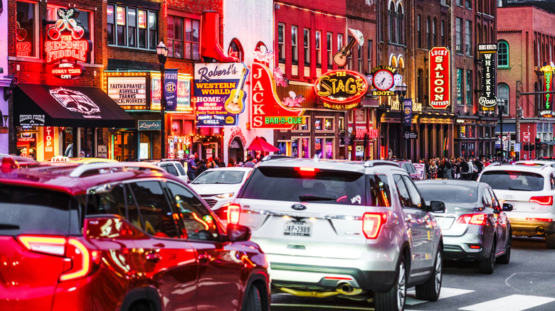 View of traffic backed up on Lower Broadway in downtown Nashville at dusk