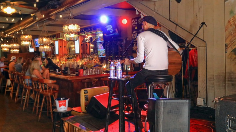 Back view of a singer performing at a Nashville, Tennessee bar