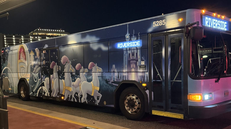 Cinderella themed bus going to Disney's Port Orleans Riverside Resort from Magic Kingdom at night