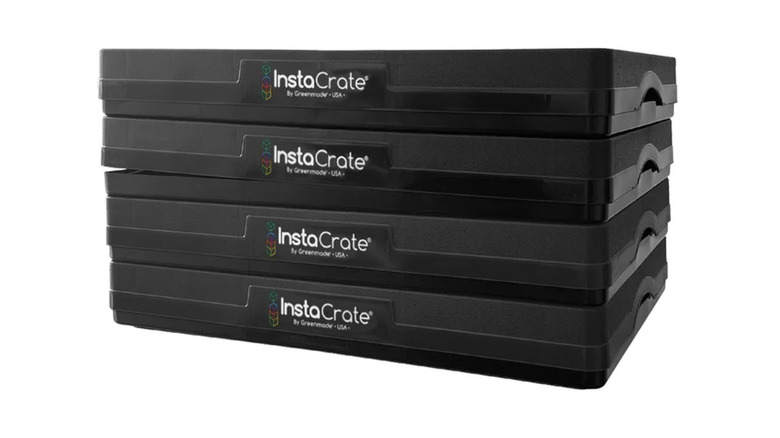 Stack of four collapsed InstaCrate boxes on a white background