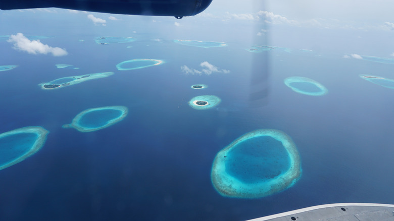 Stunning aerial view of the maldives archipelago, showcasing its unique ring-shaped atolls
