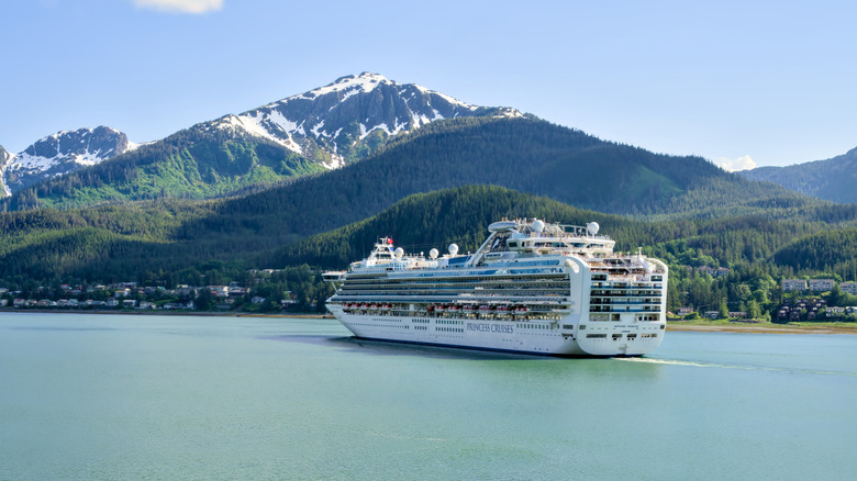 Juneau, Alaska, USA - 06 20 2024: View of The Sapphire Princess cruise ship operated by Princess Cruises with view of the Alaskan wilderness