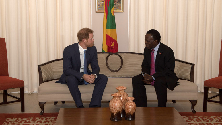 Prince Harry (left) meets the Minister of Grenada (right)