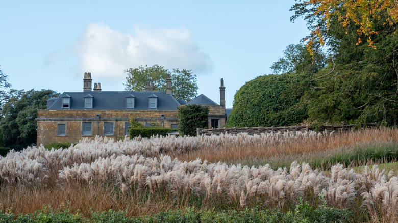 Exterior of The Newt with a lush field in Castle Cary, Somerset, U.K.