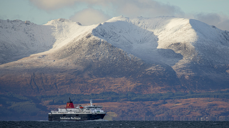 Isle of Arran with ferry moving past in foreground