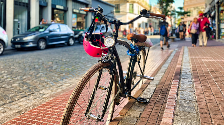 A vintage bicycle parked on a small San Telmo shopping street.
