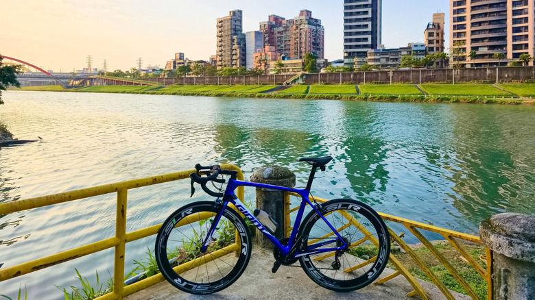 A bucycle next to the river in taipei.