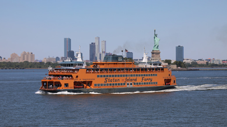 The Staten Island Ferry passes the Statue of Liberty in New York Harbor.