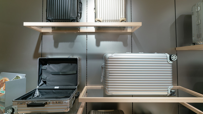 View of Rimowa suitcases with grooved aluminum shells on display at a high-end Hong Kong store