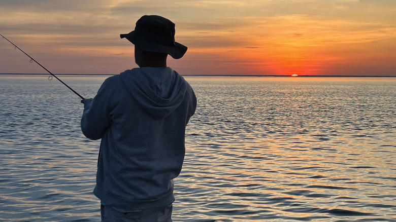 Fishing at sunset on Lake St. Claire, Michigan.