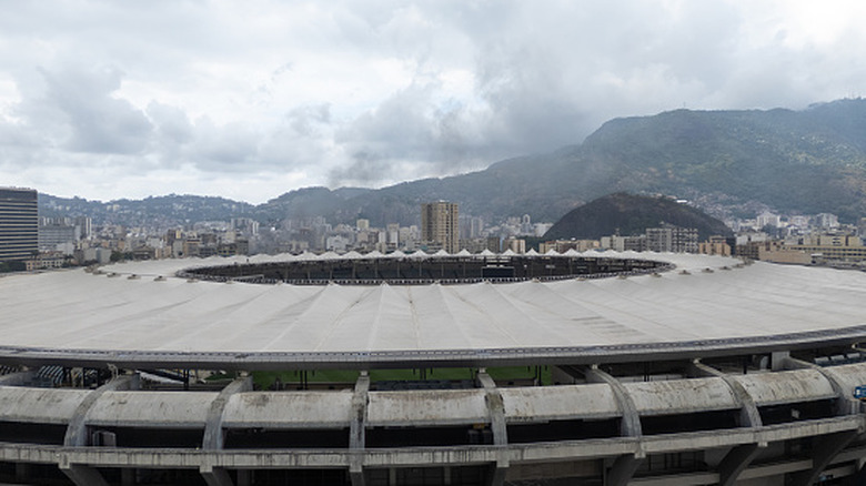 Iconic Maracanã Stadium in Rio, Brazil, captured from above with its circular design and surrounding cityscape.