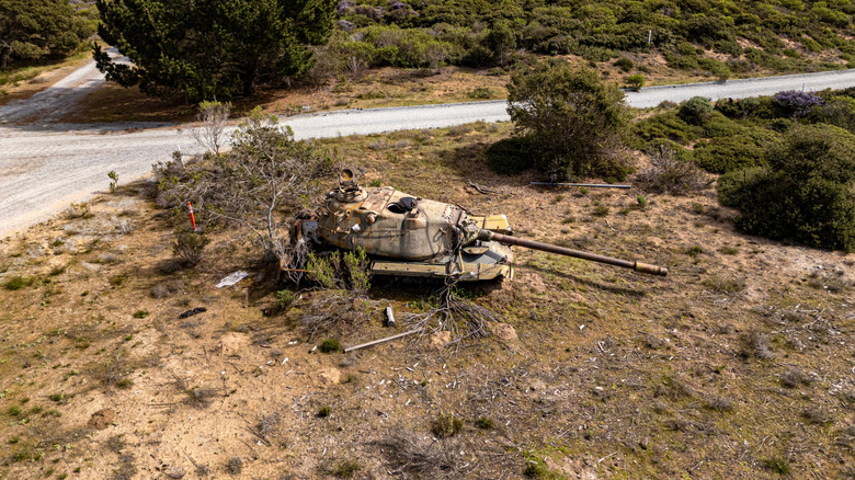 Decaying abandoned tank by the side of the road at Fort Ord State Park, California
