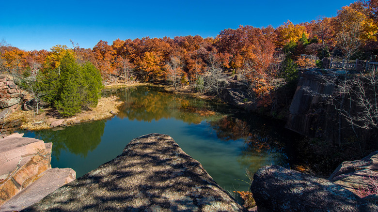View of flooded quarry pit at Elephant Rocks State Park in Missouri on a sunny day