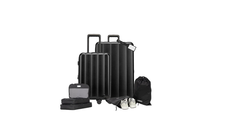 View of black CALPAK Evry Eight-Piece Travel Bundle on white background