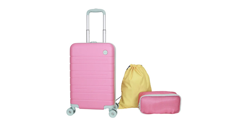 View of pink iPack Kids Carry-On Luggage Set with yellow laundry bag on white background