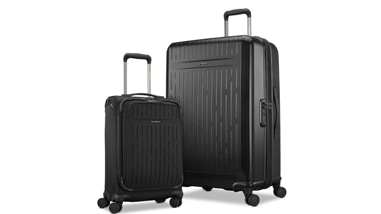 View of black Samsonite Symmetry Two-Piece Hybrid Luggage Set on white background