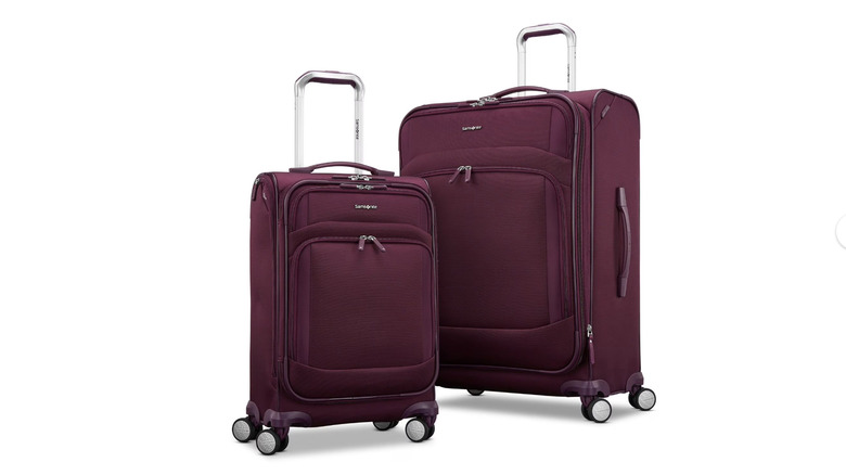 View of burgundy Samsonite Xpression Two-Piece Softside Spinner Luggage Set on white background