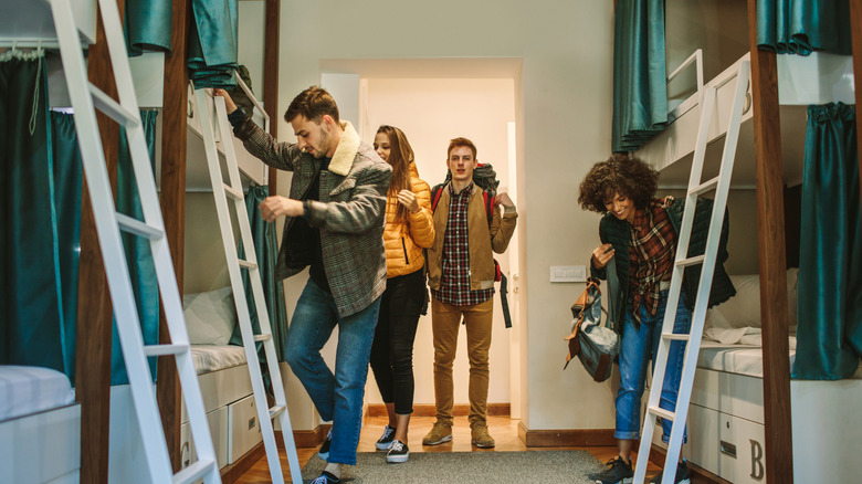 Young travelers arriving in hostel