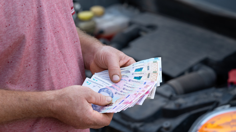 Man countinf foreign currency