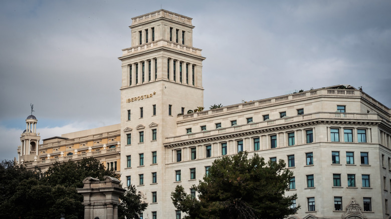 View of Iberostar headquarters with their logo visible in gold on a cloudy day